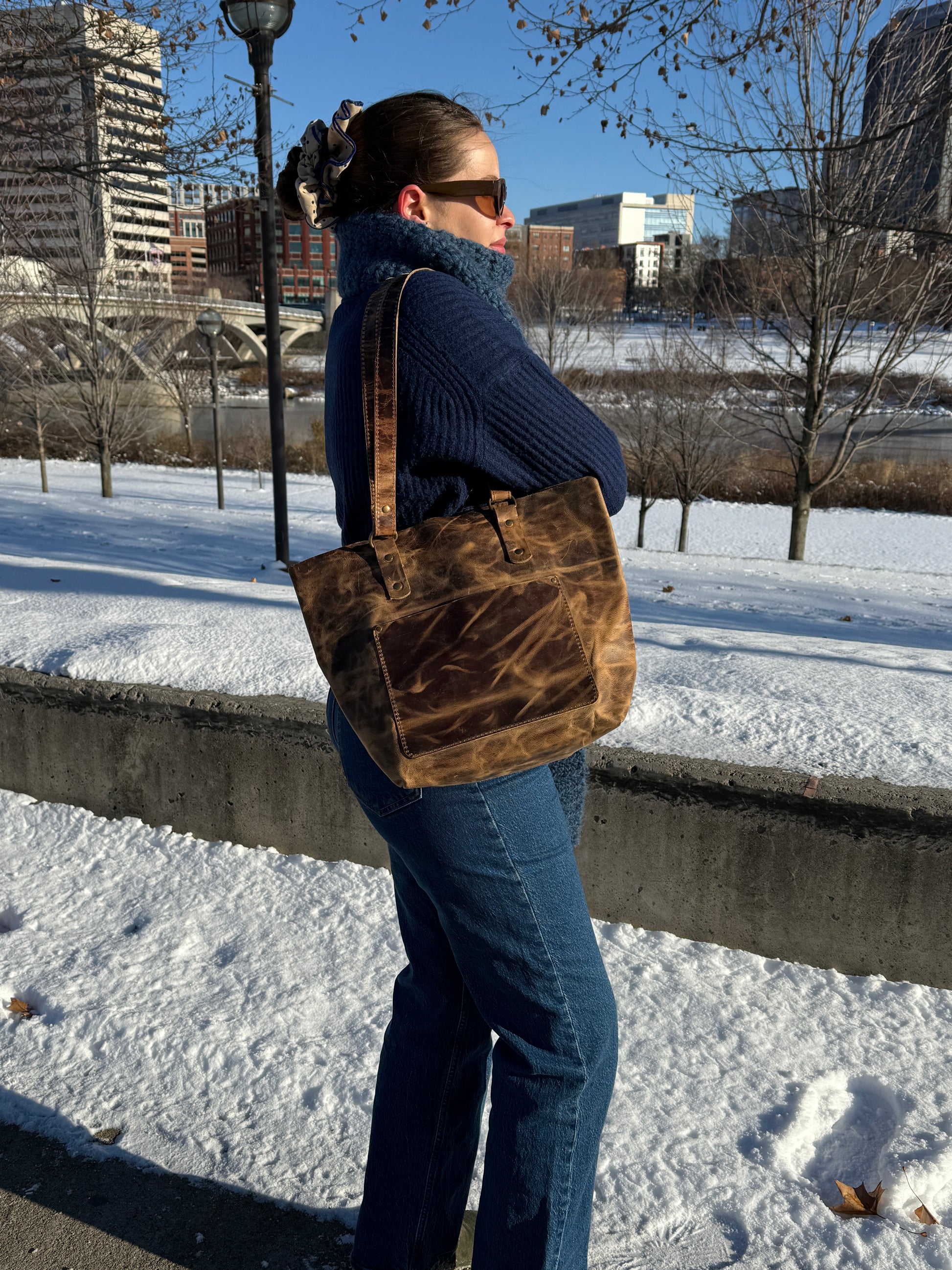 Daily leather tote worn on shoulder lifestyle shot